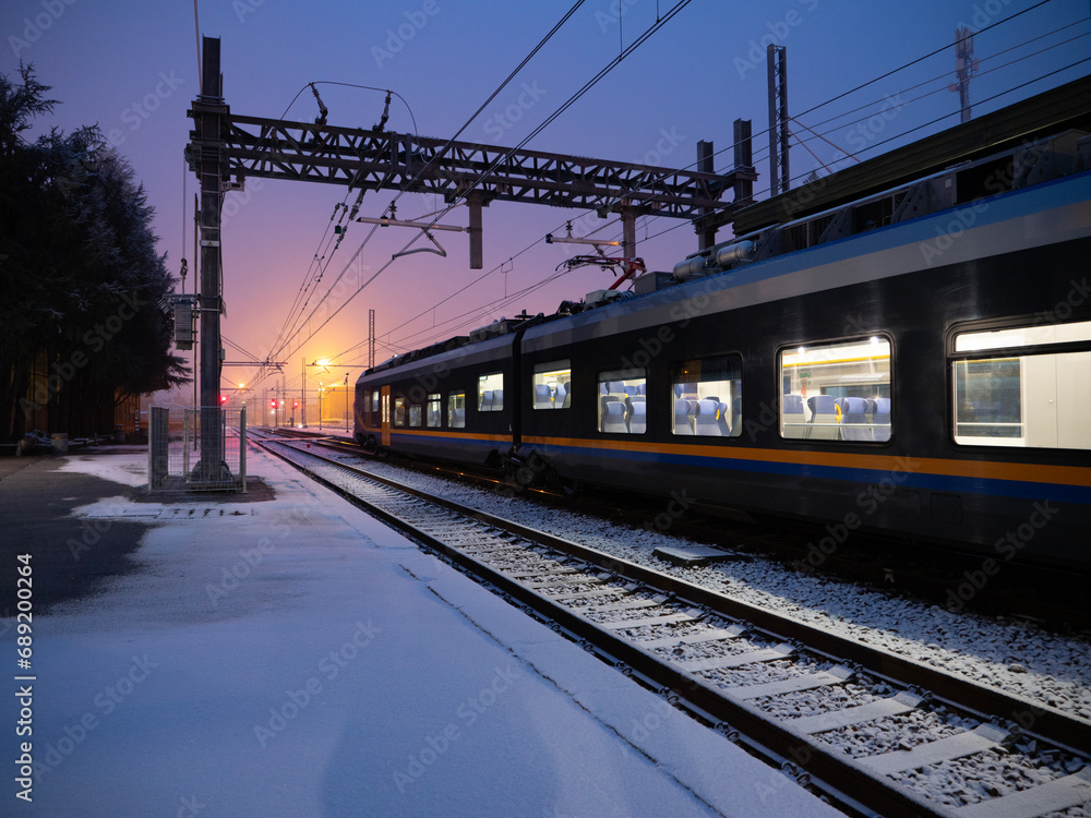 Fototapeta premium train station winter snow in the morning
