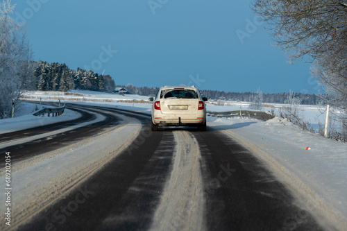 Car driving on icy winter road in Sweden