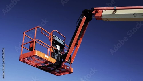 Industrial boom lift and sky