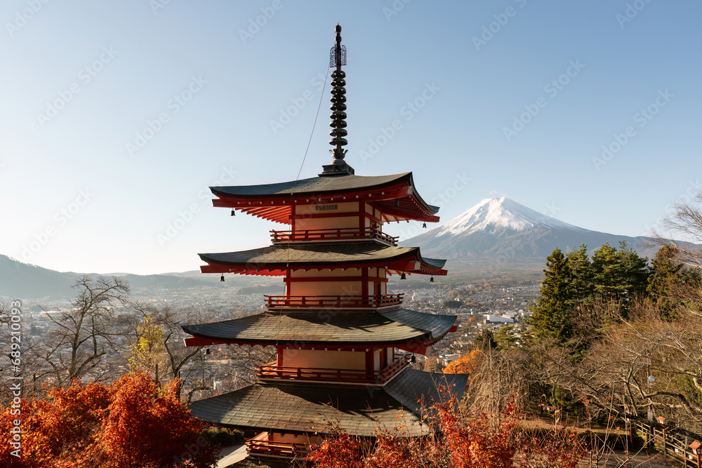 Red autumn in Japan. Chureito pagoda in Fujiyoshida with mount Fuji. Beautiful japanese landmark and landscape. Pagoda and autumn tree in Japan seasonal