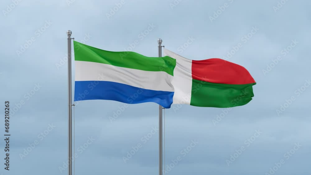 Madagascar flag and Sierra Leone flag waving together on cloudy sky, endless seamless loop, two country relations concept Madagascar flag and Sierra Leone flag waving together on cloudy sky, endless seamless loop, two country relations concept