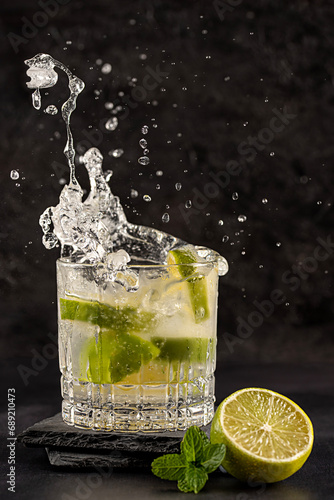 Photography of cocktail with lime, splash, mojito, mint, ice, drink, mocktail, freshness, elegance, celebration, glamour