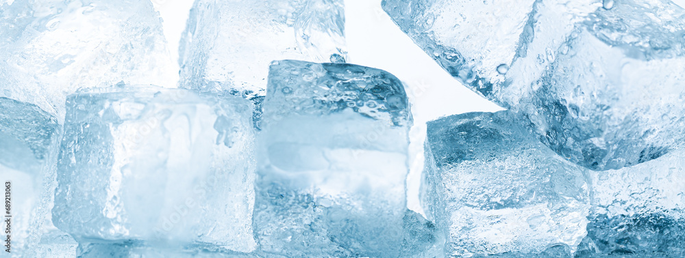 Ice cubes isolated white background,Realistic frozen ice cubes and water wave splashes, kitchen skinali panel background. Ice cubes whirl in liquid blue clear aqua wave, splatters of clean drink swirl Ice cubes isolated white background,Realistic frozen ice cubes and water wave splashes, kitchen skinali panel background. Ice cubes whirl in liquid blue clear aqua wave, splatters of clean drink swirl
