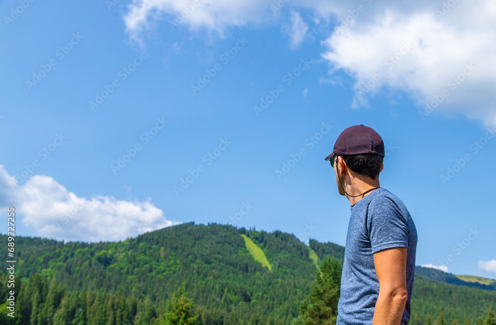 A man in the mountains looks. Selective focus. Selective focus. A man in the mountains looks. Selective focus. Selective focus.