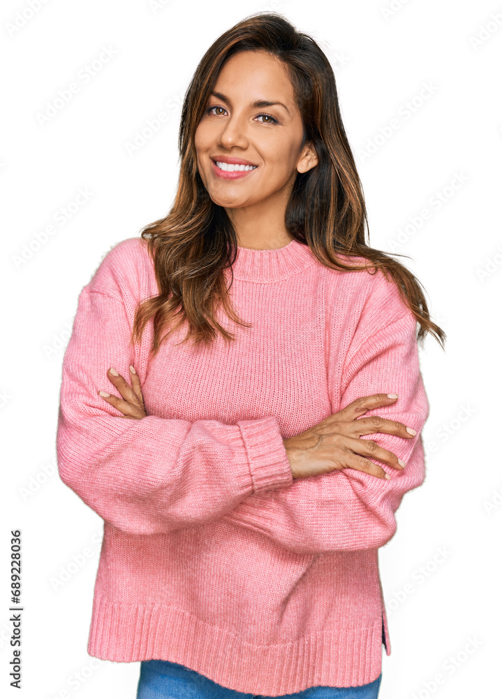 Young hispanic woman wearing casual clothes happy face smiling with crossed arms looking at the camera. positive person. Young hispanic woman wearing casual clothes happy face smiling with crossed arms looking at the camera. positive person.