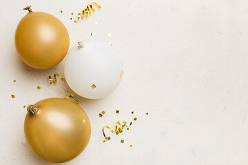 Background with fastive air balloons of round shape and confetti, multicoloured top view. Birthday party background