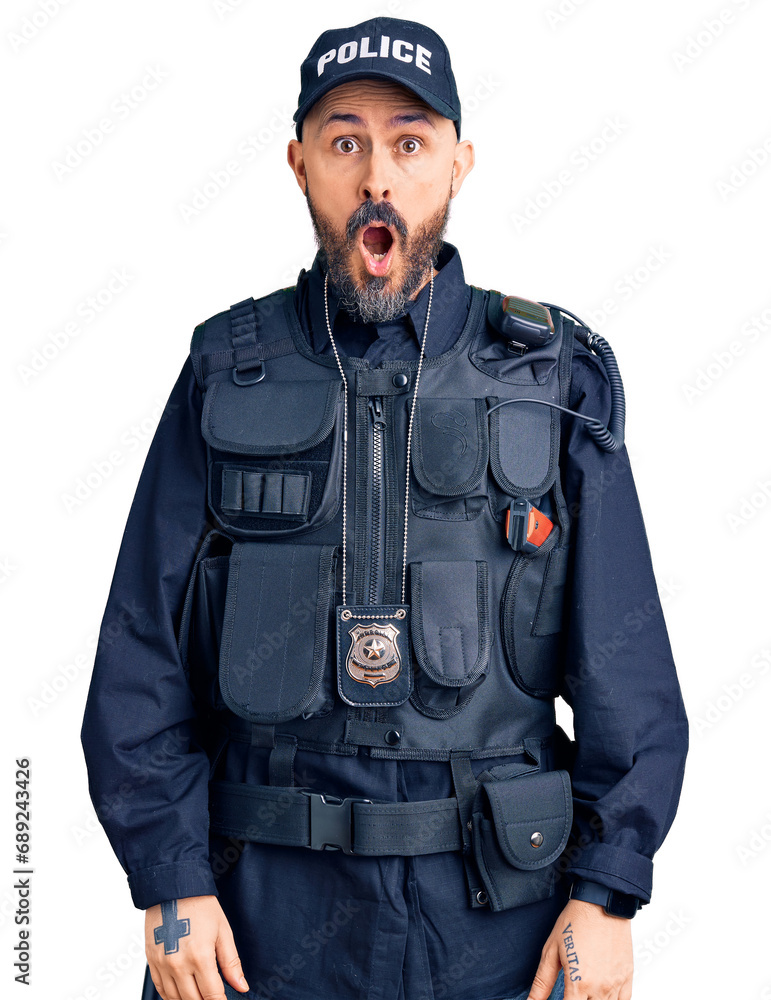 Young handsome man wearing police uniform afraid and shocked with surprise and amazed expression, fear and excited face. Young handsome man wearing police uniform afraid and shocked with surprise and amazed expression, fear and excited face.
