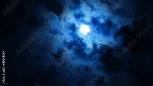 The moon night view with the full moon and clouds in the sky