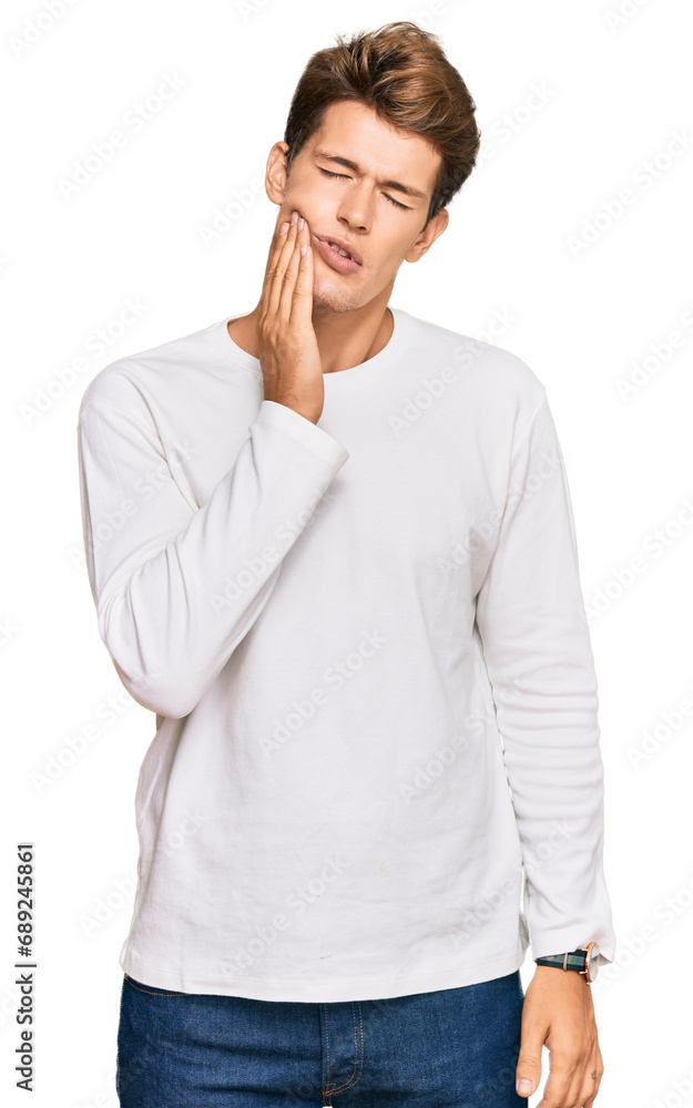 Handsome caucasian man wearing casual white sweater touching mouth with hand with painful expression because of toothache or dental illness on teeth. dentist Handsome caucasian man wearing casual white sweater touching mouth with hand with painful expression because of toothache or dental illness on teeth. dentist