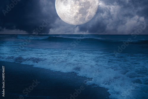 Harvest moon over the ocean photo