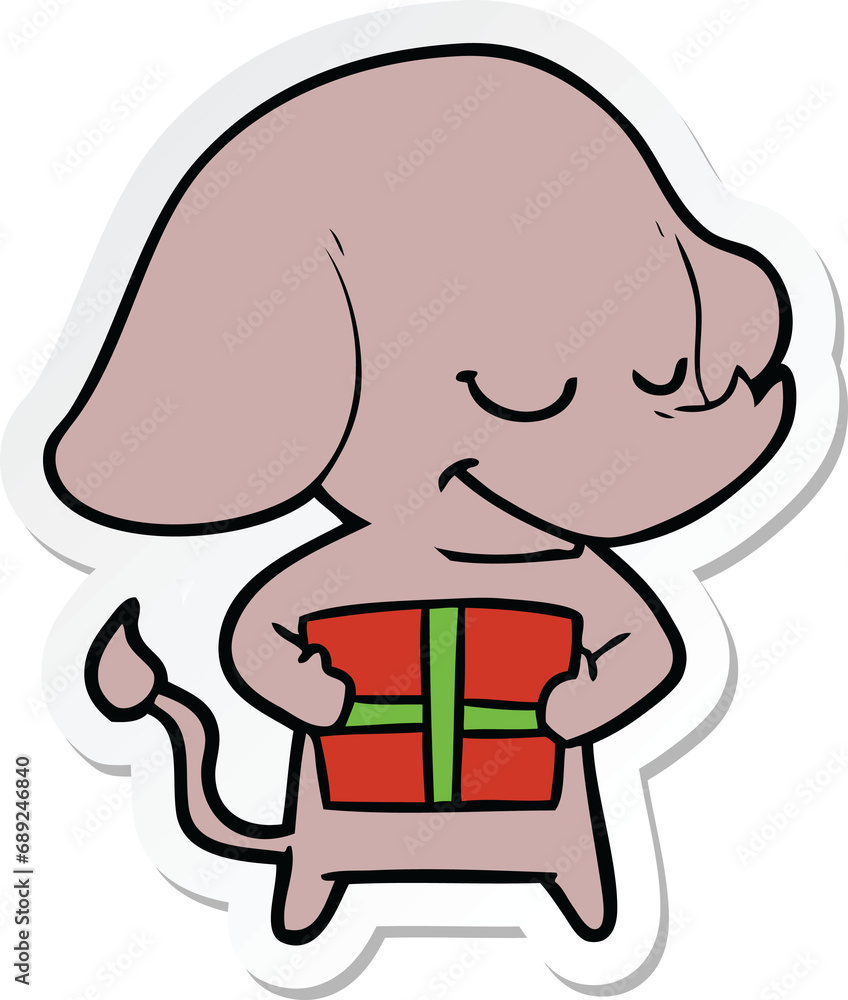 sticker of a cartoon smiling elephant with present