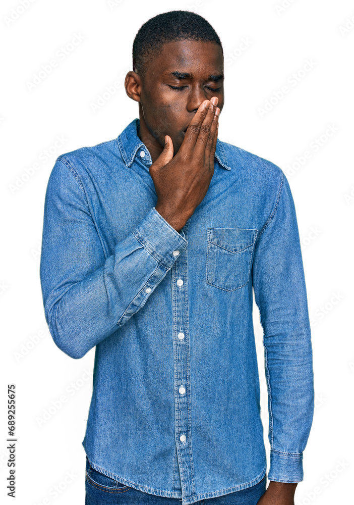 Young african american man wearing casual clothes bored yawning tired covering mouth with hand. restless and sleepiness. Young african american man wearing casual clothes bored yawning tired covering mouth with hand. restless and sleepiness.