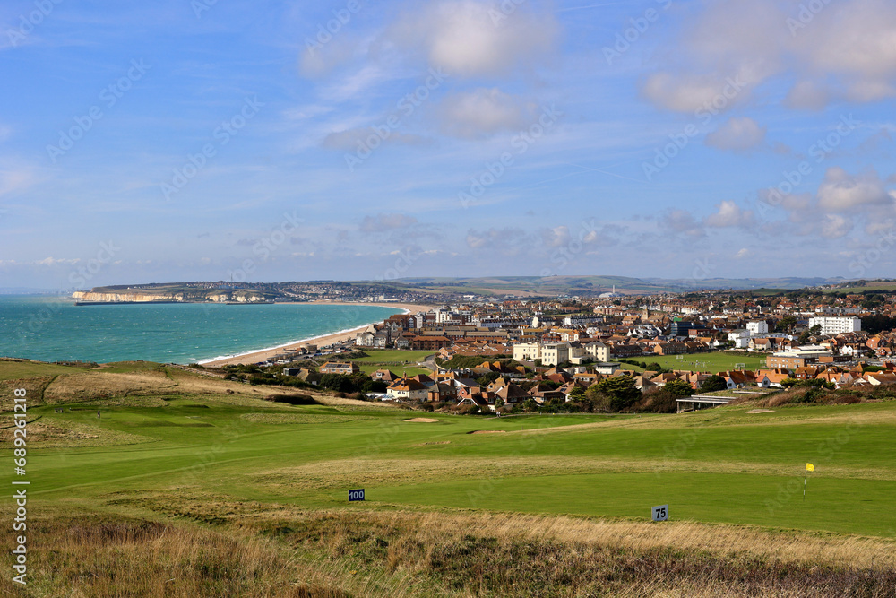 View of Seaford Beach and a golf course, East Sussex, England, UK.