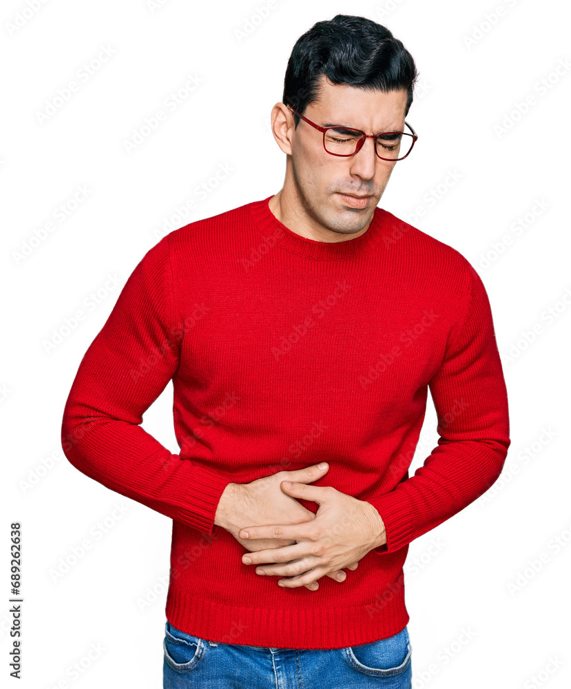 Φωτογραφία Handsome hispanic man wearing casual clothes and glasses with hand on stomach because indigestion, painful illness feeling unwell