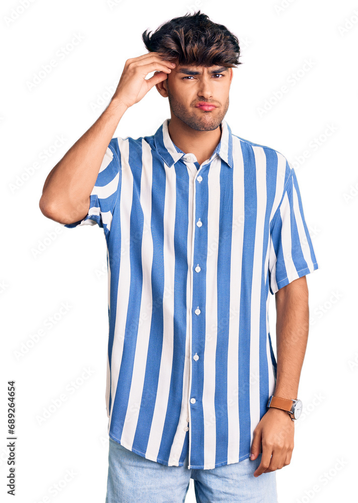 Young hispanic man wearing casual clothes worried and stressed about a problem with hand on forehead, nervous and anxious for crisis Young hispanic man wearing casual clothes worried and stressed about a problem with hand on forehead, nervous and anxious for crisis