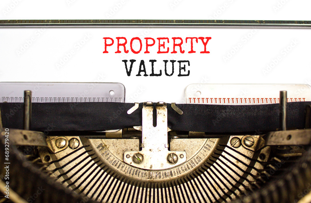 Property value symbol. Concept words Property value typed on beautiful old retro typewriter. Beautiful white paper background. Business property value concept. Copy space.