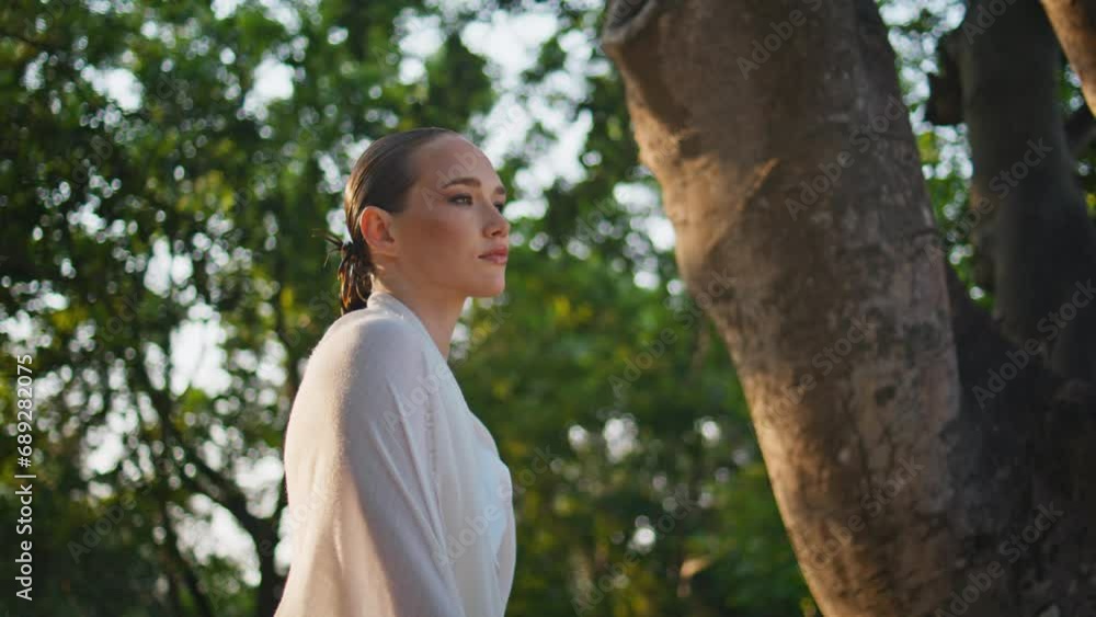 Dreamy lady standing forest wrapping at white fabric close up. Woman relaxing Dreamy lady standing forest wrapping at white fabric close up. Woman relaxing