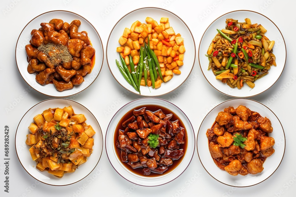 different meals are shown in white dishes, Chinese appetizers including chile chicken, spring rolls, rice and beans different meals are shown in white dishes, Chinese appetizers including chile chicken, spring rolls, rice and beans