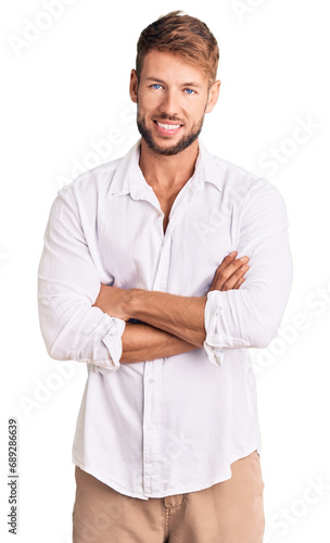 Young caucasian man wearing casual clothes happy face smiling with crossed arms looking at the camera. positive person. © Krakenimages.com