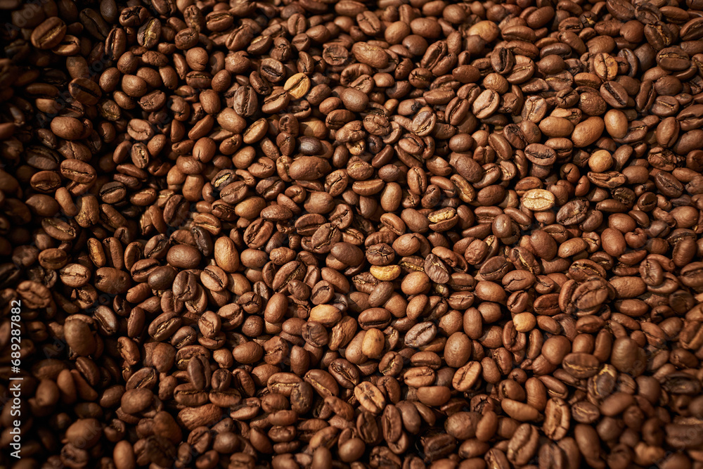 Top view background image of fresh roasted coffee beans, copy space Top view background image of fresh roasted coffee beans, copy space