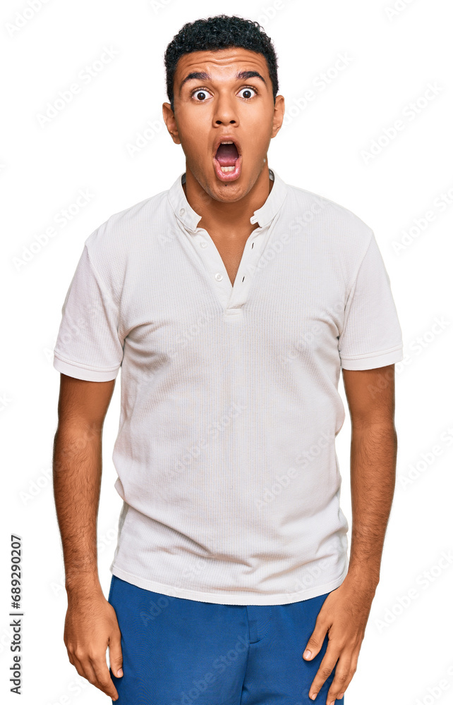 Young arab man wearing casual clothes afraid and shocked with surprise and amazed expression, fear and excited face. Young arab man wearing casual clothes afraid and shocked with surprise and amazed expression, fear and excited face.