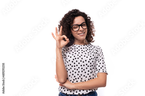 young stylish caucasian woman with curly perm hair looks happy and confident