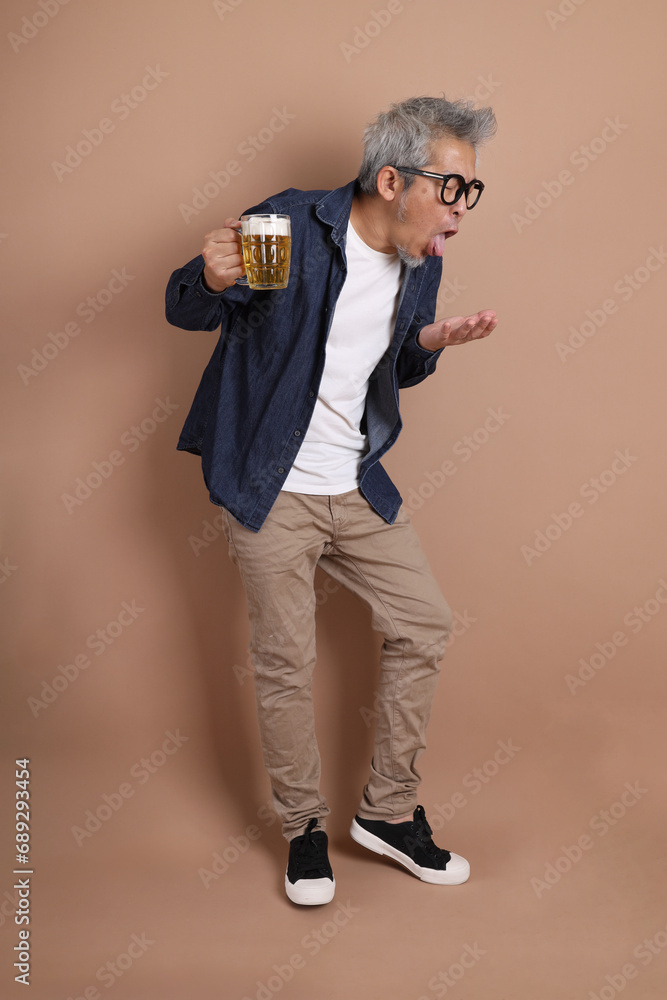Holding a beer mug.Holding a beer mug Holding a beer mug.Holding a beer mug
