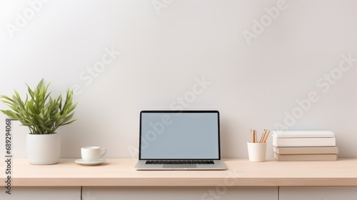 A laptop computer sitting on top of a wooden desk. © tilialucida