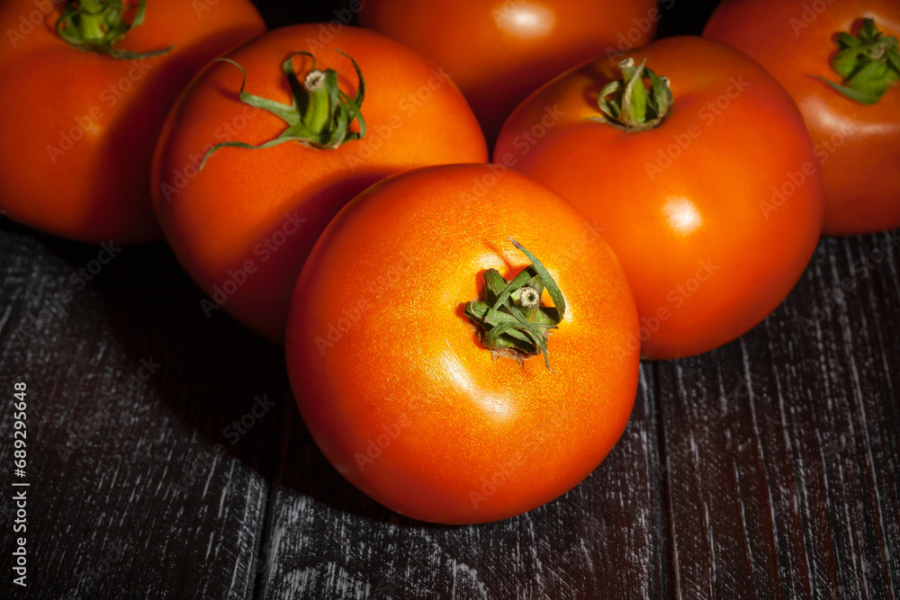 orange tomato on wood background orange tomato on wood background
