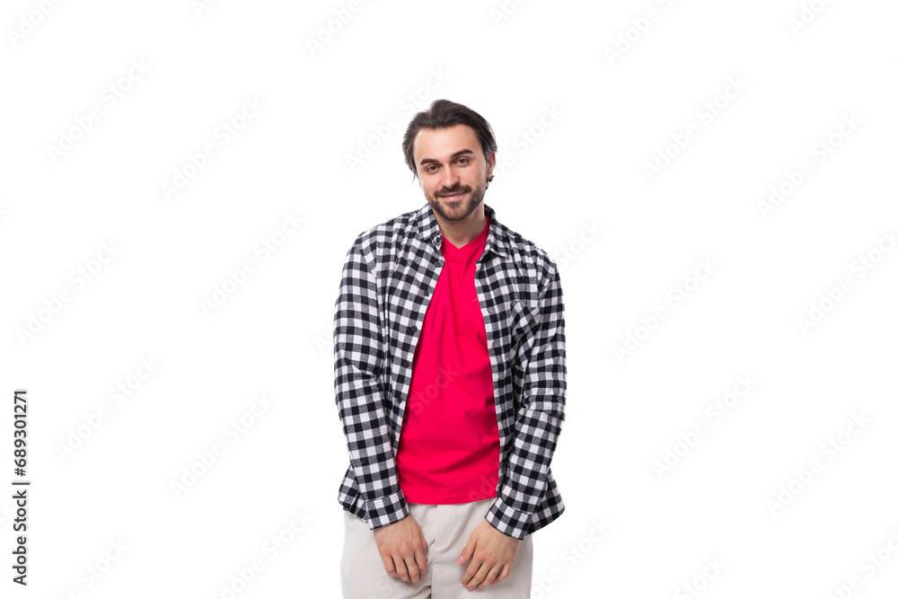 portrait of a young caucasian handsome guy with a beard and styled hair dressed in a plaid shirt portrait of a young caucasian handsome guy with a beard and styled hair dressed in a plaid shirt