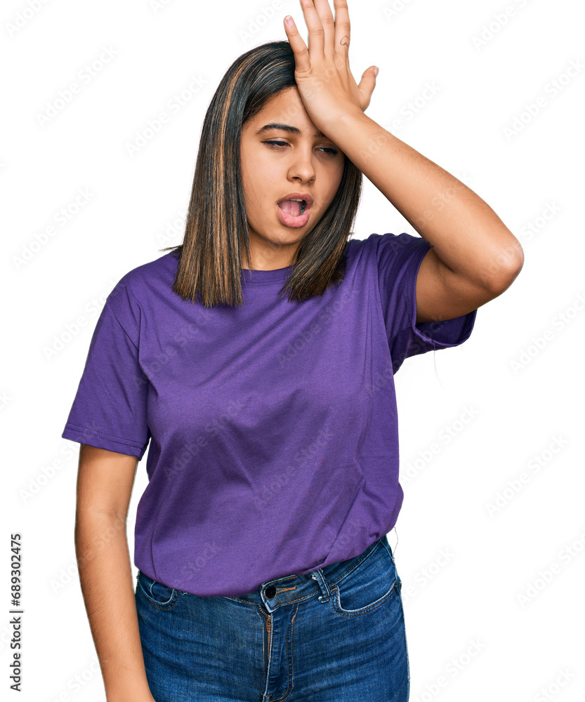 Young hispanic girl wearing casual purple t shirt surprised with hand on head for mistake, remember error. forgot, bad memory concept. Young hispanic girl wearing casual purple t shirt surprised with hand on head for mistake, remember error. forgot, bad memory concept.