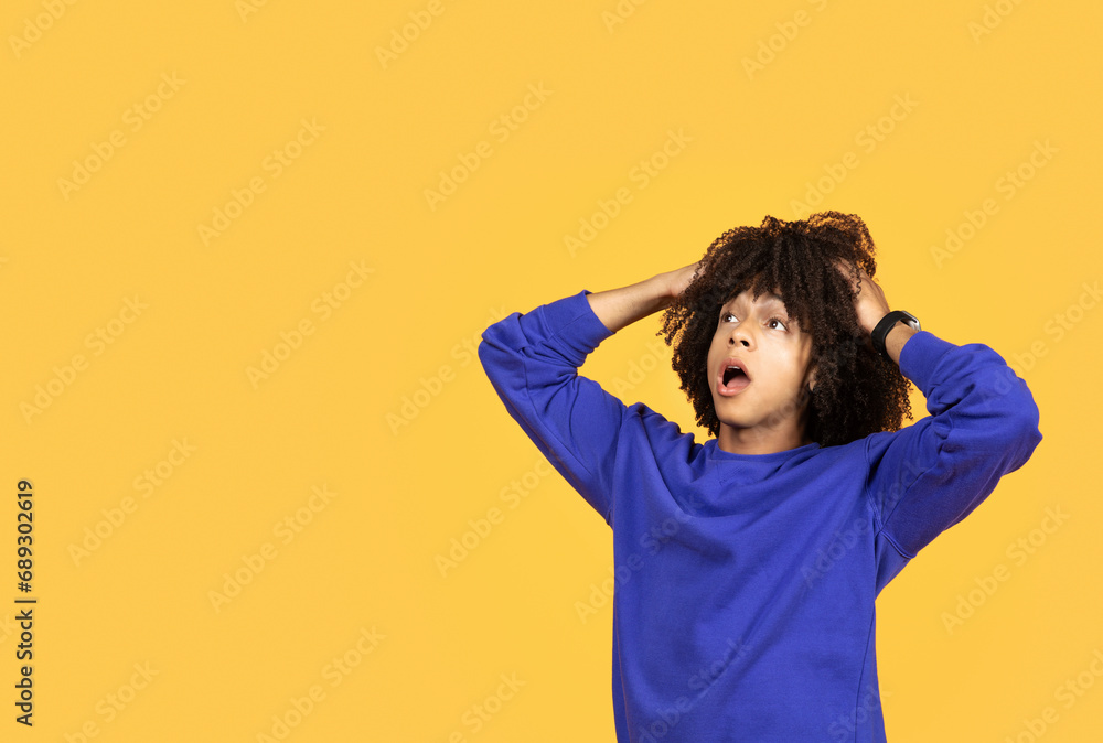 Black Man Opening Mouth And Touching Head While Looking At Copy Space Black Man Opening Mouth And Touching Head While Looking At Copy Space
