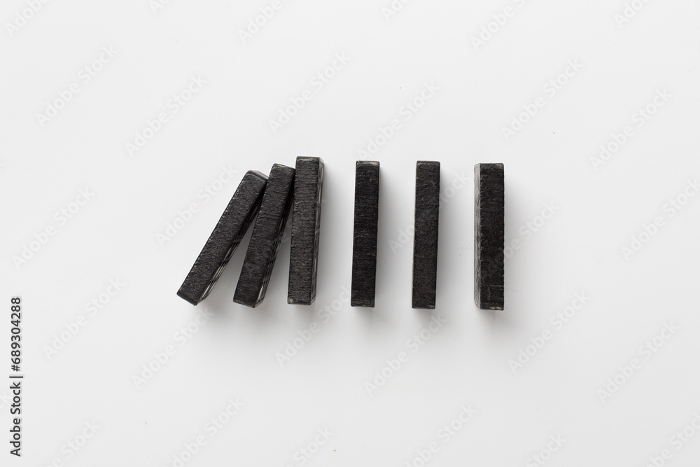 Black domino tiles on white background, top view Black domino tiles on white background, top view