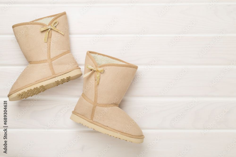 Beautiful boots on color background,top view Beautiful boots on color background,top view