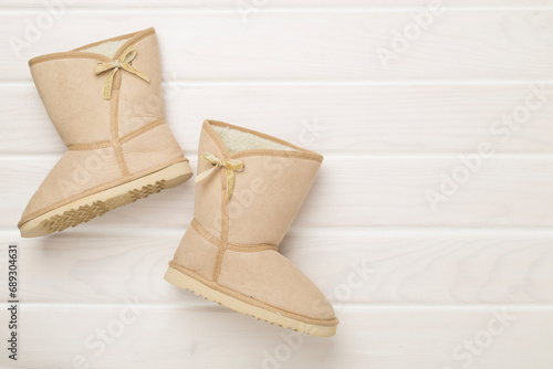 Beautiful boots on color background,top view