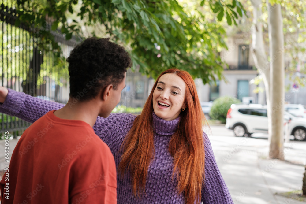 Two friends meeting again and giving each other a hug when they see each other. Concept: lifestyle, together Two friends meeting again and giving each other a hug when they see each other. Concept: lifestyle, together
