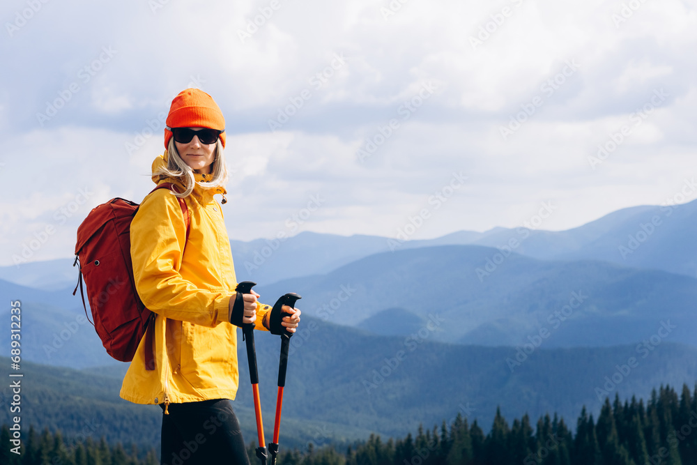Girl Traveler hiking with backpack at the mountains landscape. Travel Lifestyle concept adventure summer vacations outdoor