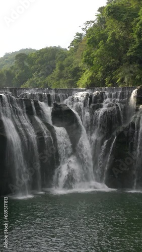 Vertical footage of Shifen Waterfall in Pingxi District, New Taipei City, Taiwan photo