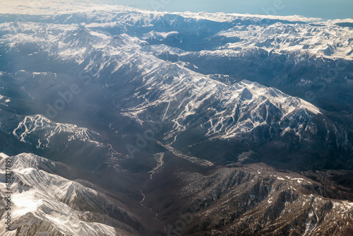Top view of the high mountain peaks covered with snow