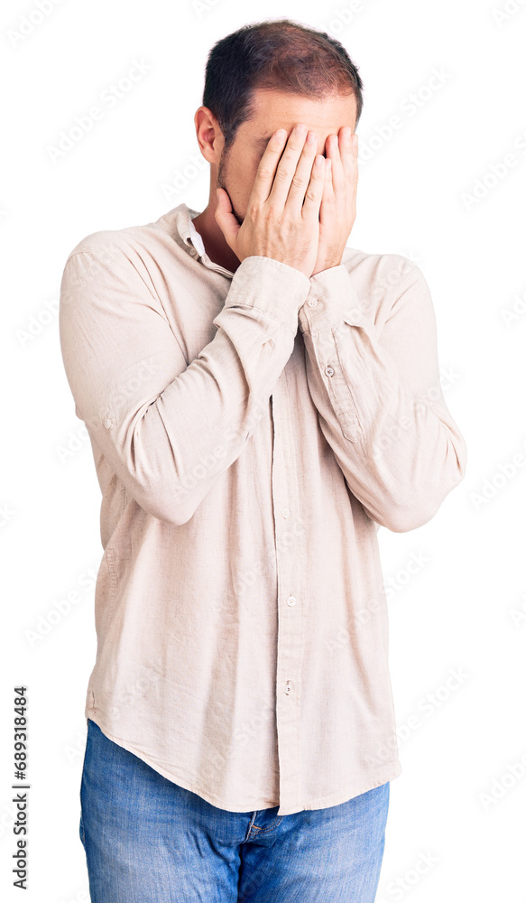 Young handsome caucasian man wearing casual clothes with sad expression covering face with hands while crying. depression concept. Young handsome caucasian man wearing casual clothes with sad expression covering face with hands while crying. depression concept.