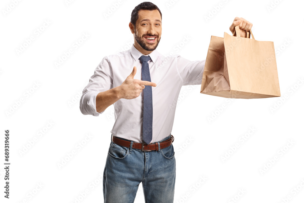 Man pointing at a paper bag and smiling Man pointing at a paper bag and smiling