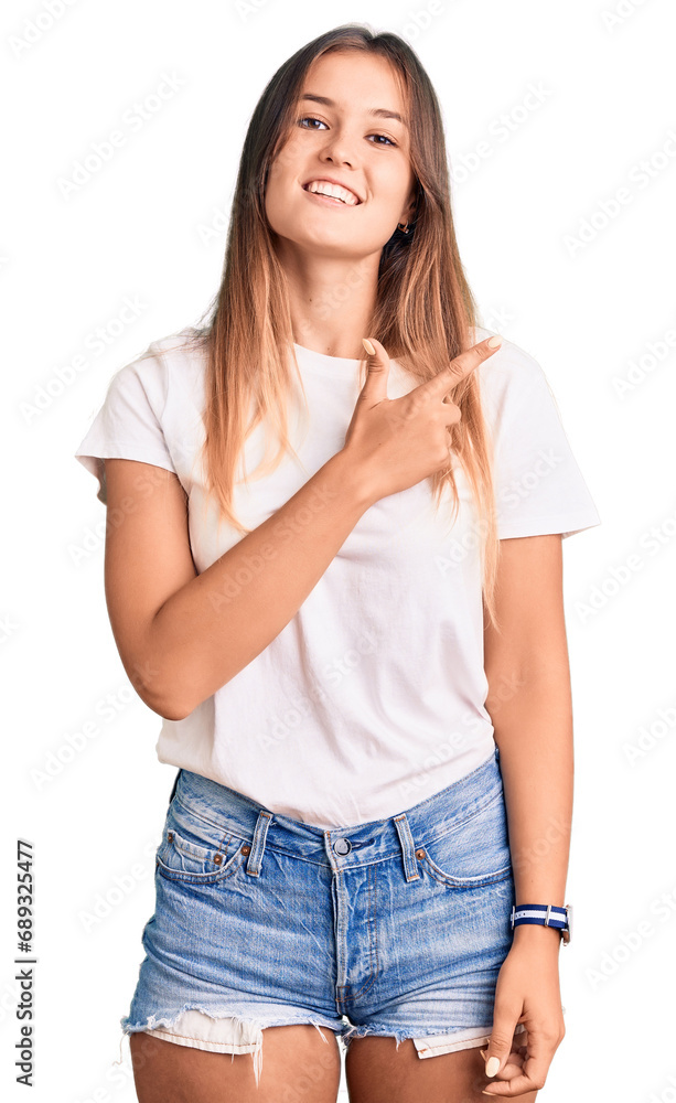 Obraz premium Beautiful caucasian woman wearing casual white tshirt cheerful with a smile on face pointing with hand and finger up to the side with happy and natural expression
