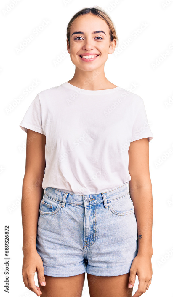 Obraz premium Young beautiful blonde woman wearing casual white tshirt with a happy and cool smile on face. lucky person.