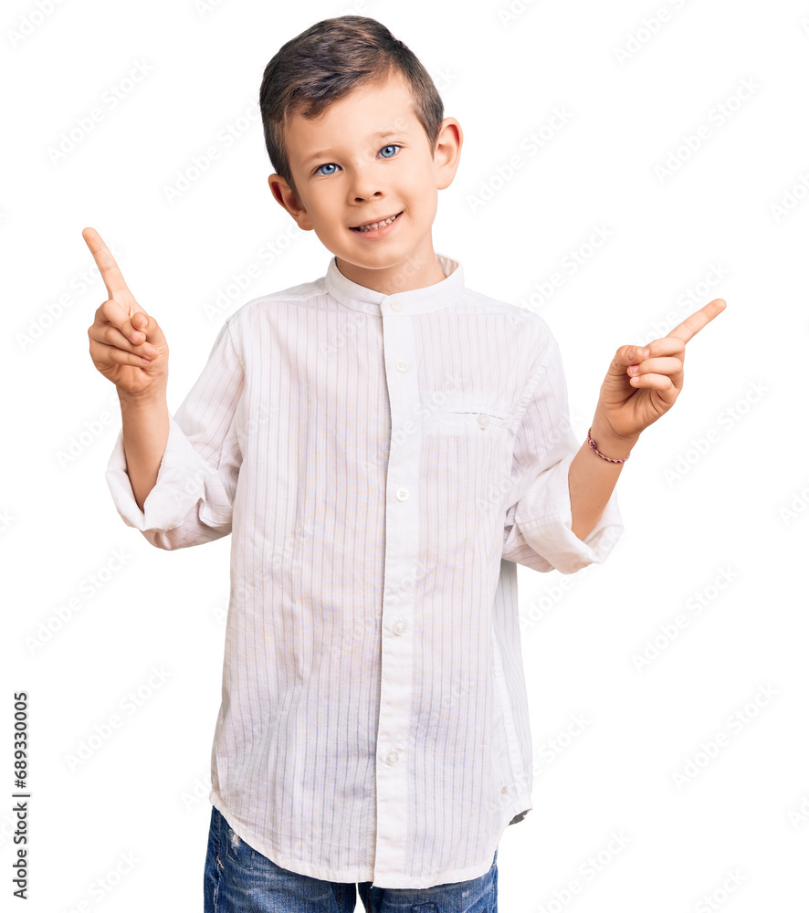 Cute blond kid wearing elegant shirt smiling confident pointing with fingers to different directions. copy space for advertisement Cute blond kid wearing elegant shirt smiling confident pointing with fingers to different directions. copy space for advertisement