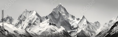 Black and white panoramic shot of towering mountain peaks