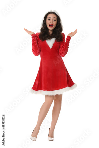 Beautiful young woman in Christmas red dress isolated on white © New Africa