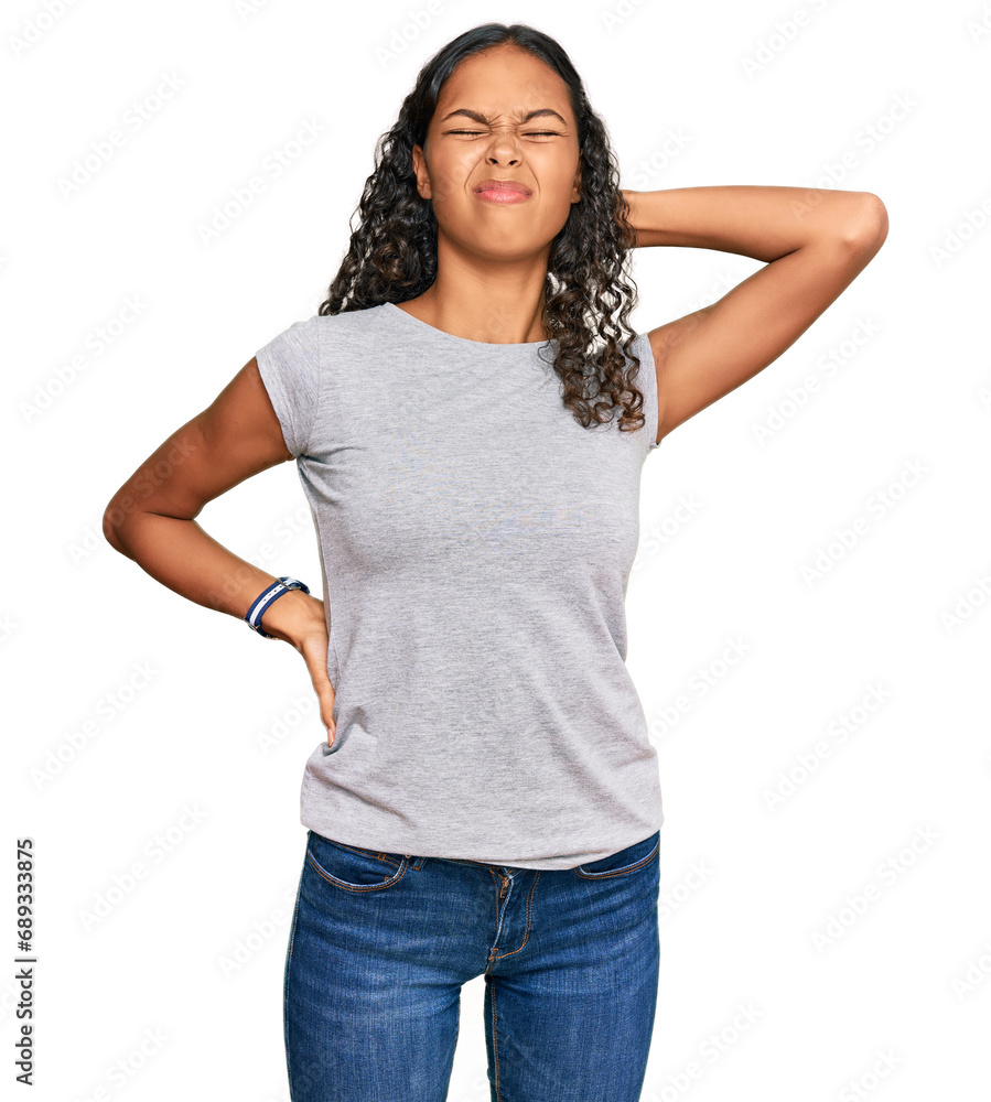 Obraz premium Young african american girl wearing casual clothes suffering of neck ache injury, touching neck with hand, muscular pain