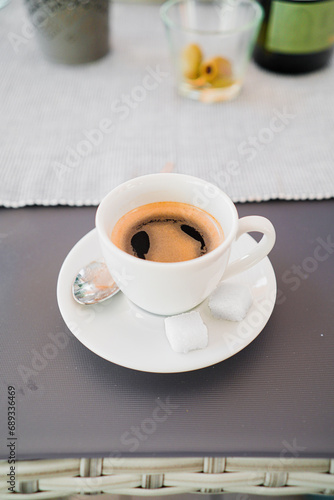 Cup of Coffe as Espresso with Sugar in a Cup photo