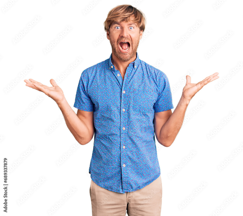 Handsome caucasian man with beard wearing casual clothes celebrating victory with happy smile and winner expression with raised hands Handsome caucasian man with beard wearing casual clothes celebrating victory with happy smile and winner expression with raised hands