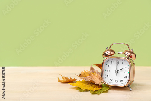 Alarm clock and autumn leav...